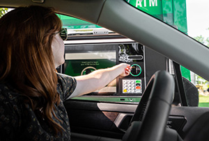 Person using a drive-up ATM serviced by NCR dealer in NJ